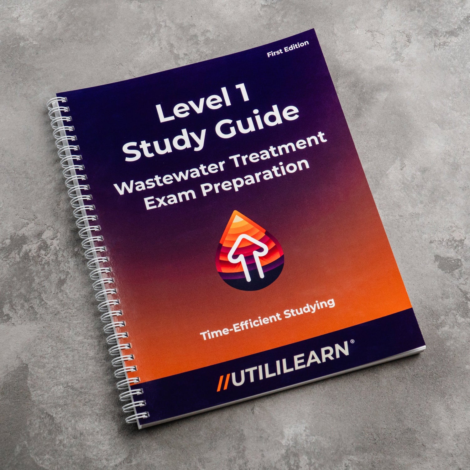 Study guide book titled 'Level 1 Study Guide Wastewater Treatment Exam Preparation' by UTILILEARN on a gray textured surface.